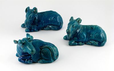 Appraisal: Two Chinese pottery goats and an ox each with a