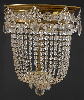 Appraisal: REGENCY-STYLE GILT-METAL AND GLASS CHANDELIER The gilt-metal rim hung with