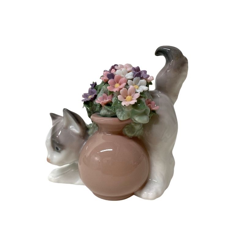 Appraisal: Lladro Cat And Flower Porcelain Lladro Cat And Flower Porcelain