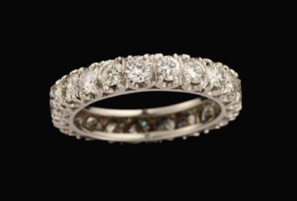 Appraisal: Platinum and diamond wedding band Twenty-one petite circular cut diamonds