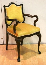 Appraisal: An elbow chair with yellow upholstery