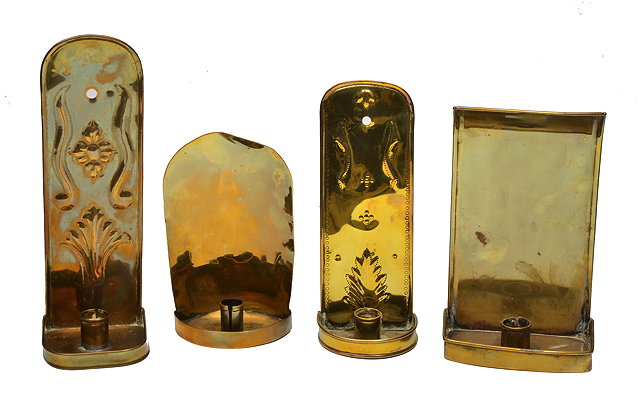 Appraisal: A GROUP OF FOUR ANTIQUE BRASS CANDLE HOLDERS with reflecting