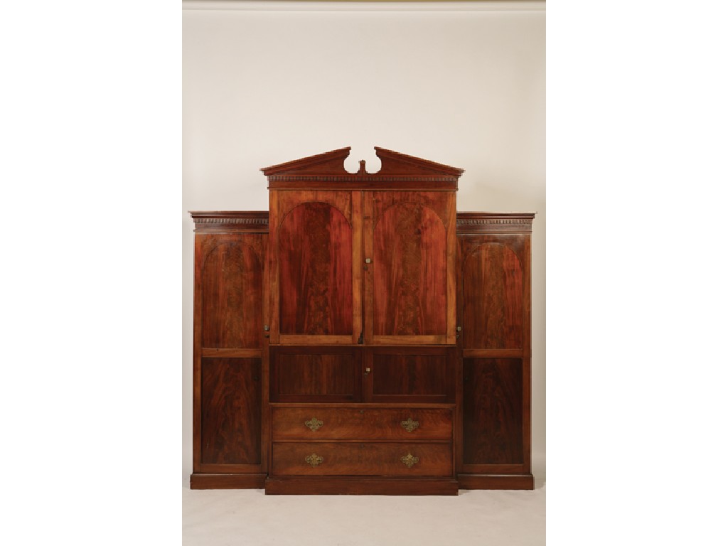 Appraisal: A REGENCY MAHOGANY BREAKFRONT WARDROBE with a break arch cornice