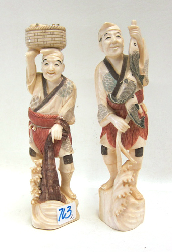 Appraisal: TWO JAPANESE IVORY CARVED FISHERMEN with polychrome treatment and holding