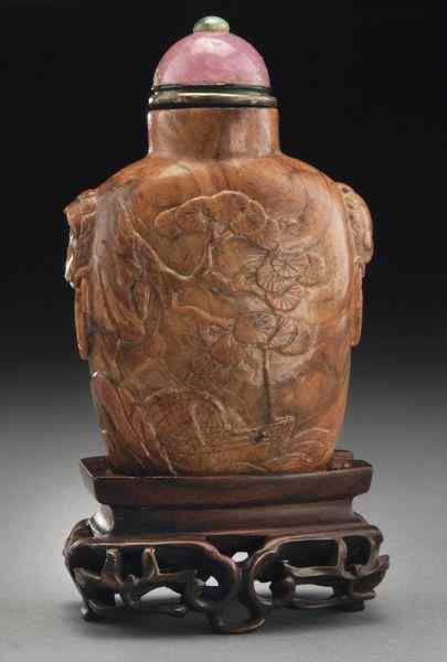 Appraisal: Chinese carved Baltic amber snuff bottledepicting lotus in a landscape