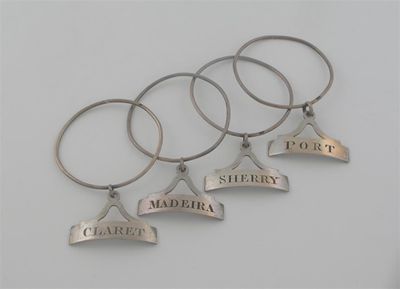 Appraisal: An early Victorian set of four neck-ring wine labels with