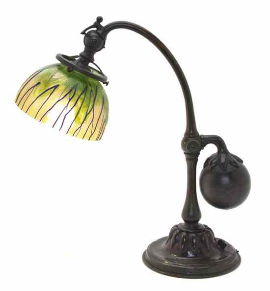 Appraisal: A Tiffany Studios Patinated Bronze Counterbalance Table Lamp having an