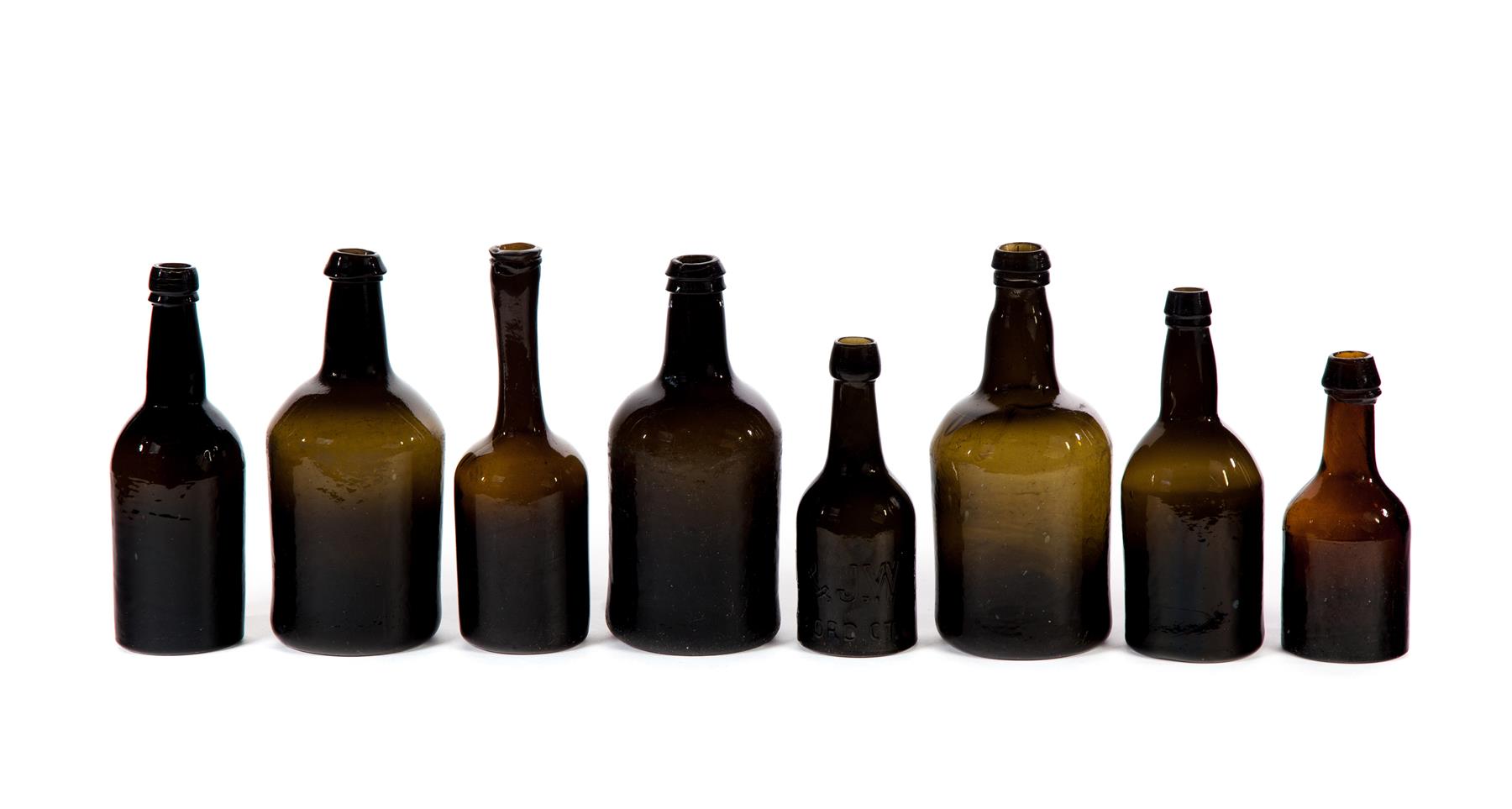 Appraisal: EIGHT GLASS BOTTLES Nineteenth century Blown and molded three with