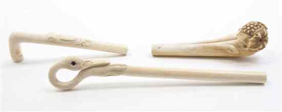 Appraisal: Three Carved Ivory Parasol Handles comprising one depicting swan's neck