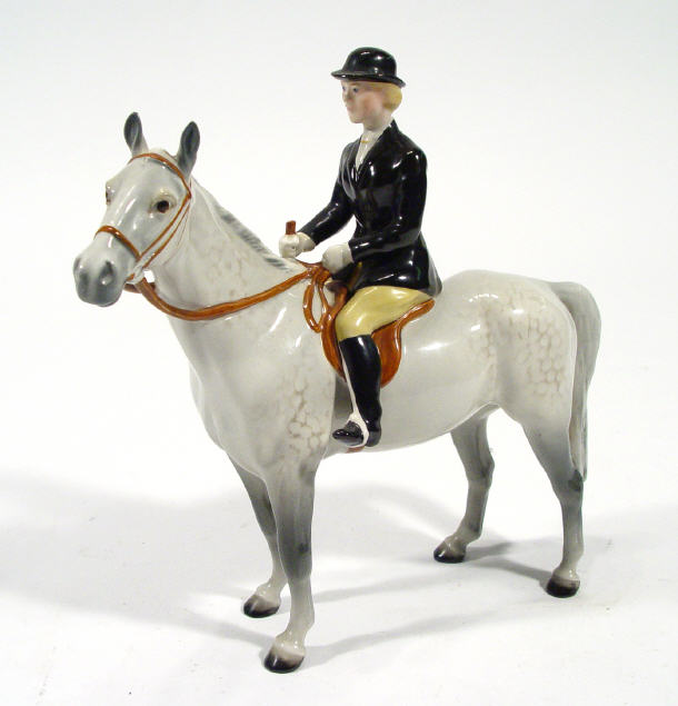 Appraisal: Hand painted Beswick huntswoman on a grey dappled horseback factory