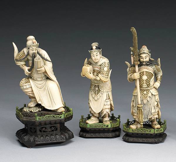 Appraisal: A group of three carved ivory warriors Circa Depicting three