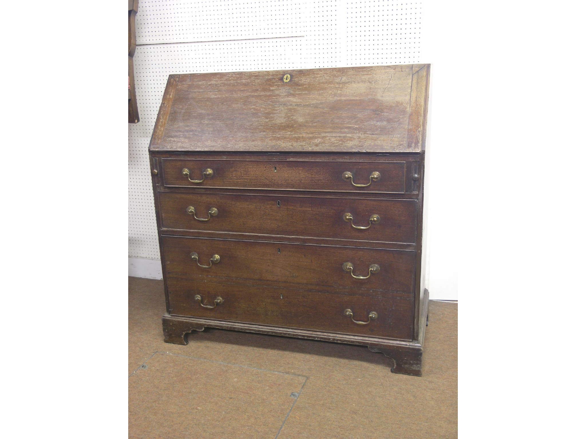 Appraisal: A George III mahogany bureau fall-front enclosing an arrangement of