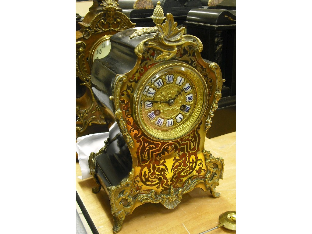 Appraisal: French boulle and ebonised two train mantel clock the Vincenti