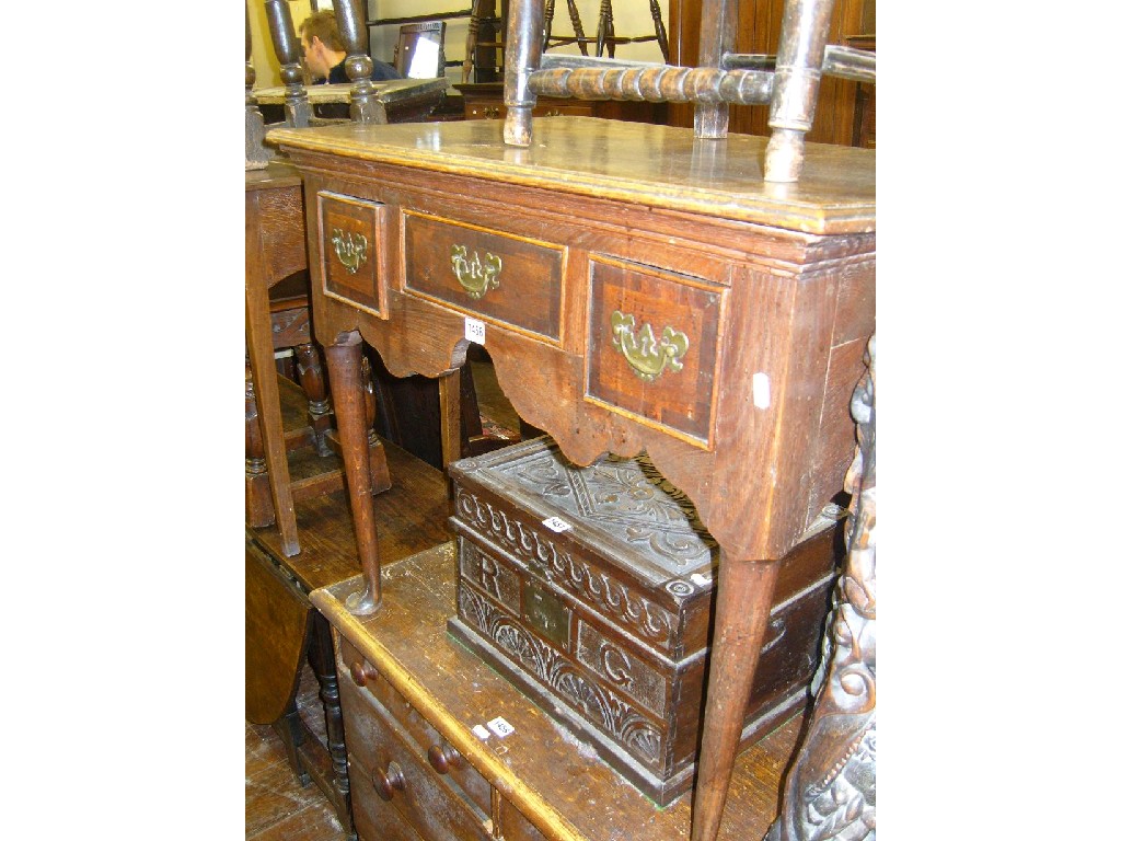 Appraisal: A Georgian oak low boy fitted with three frieze drawers