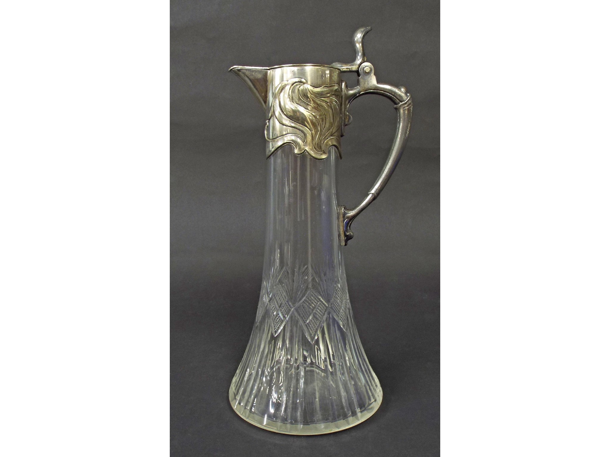 Appraisal: WMF cut glass and pewter claret jug with embossed collar