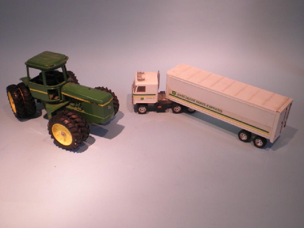 Appraisal: A die cast John Deere tractor and an Ertl plastic