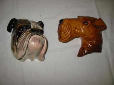 Appraisal: TWO CROWN DEVON FIELDINGS POTTERY DOG WALL MOUNTS Airedale Terrrier