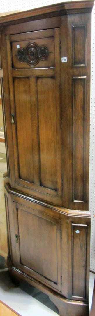 Appraisal: An early th century oak floor standing corner cabinet