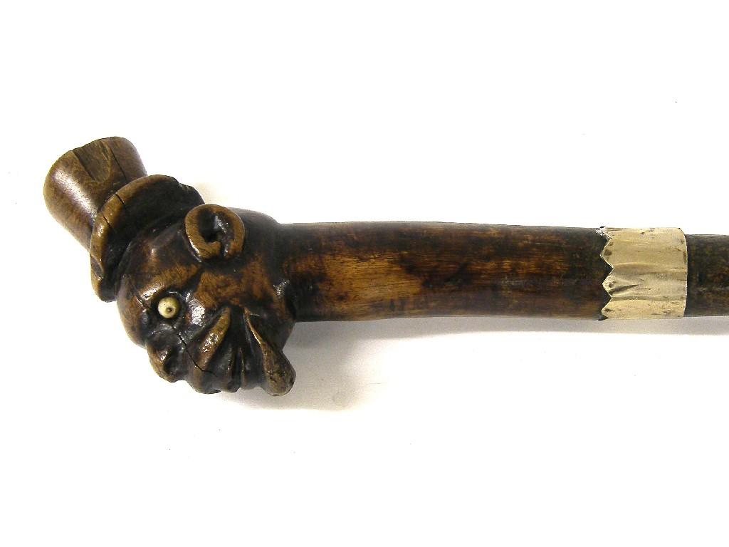 Appraisal: Antique rustic walking cane carved with the head of a