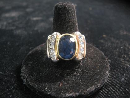 Appraisal: karat gold synthetic sapphire and diamond ringLarge oval cut sapphire