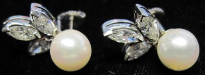 Appraisal: Pearl and diamond earrings Single pearl over three marquise cut