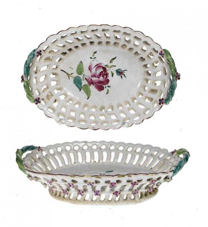 Appraisal: TWO GRADUATED CONTINENTAL FAIENCE RETICULATED OVAL BASKETS PROBABLY PROSKAU with