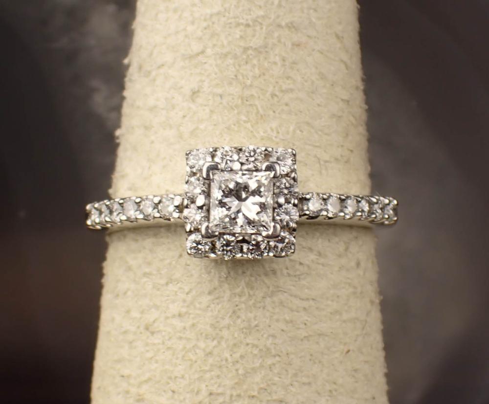 Appraisal: ESTATE DIAMOND AND FOURTEEN KARAT WHITE GOLD RING with round-cut