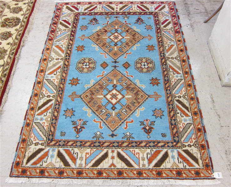 Appraisal: HAND KNOTTED ORIENTAL AREA RUG blue field Indo-Caucasian ' x