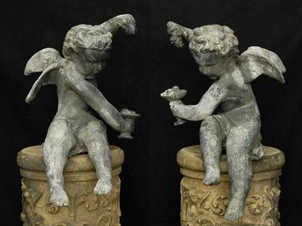 Appraisal: PAIR OF LEAD FIGURES OF BACCHIC AMORINI in tall Christie's