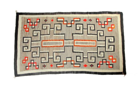 Appraisal: NAVAJO RUG Ca wool Kumbetoh design on a grey ground