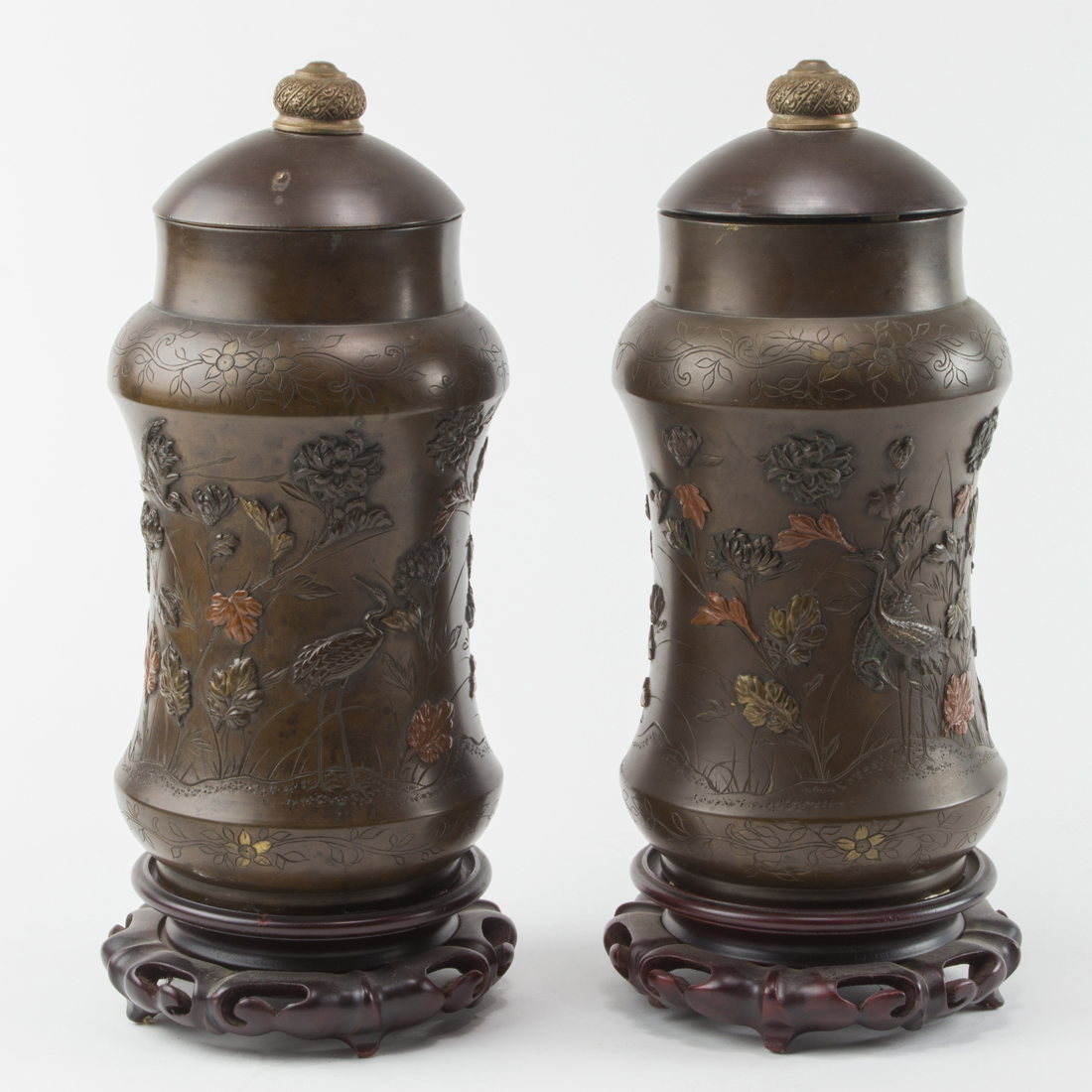 Appraisal: PAIR OF JAPANESE BRONZE LIDDED URNS Pair of Japanese bronze