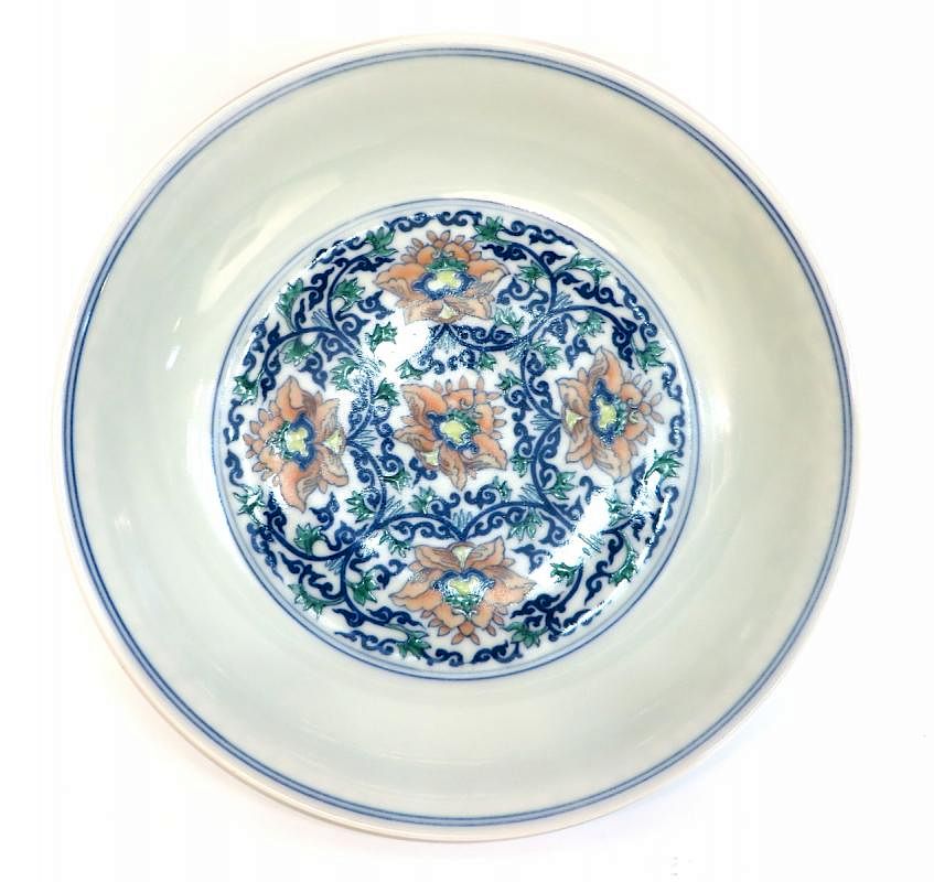 Appraisal: Youngzheng Doucai Saucer Youngzheng Doucai Saucer Description Porcelain Doucai floral