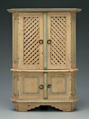 Appraisal: Miniature walnut corner cupboard two upper doors with open latticework