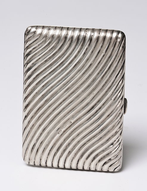 Appraisal: A SILVER CARD AND STAMP CASE with wavy reeded exterior