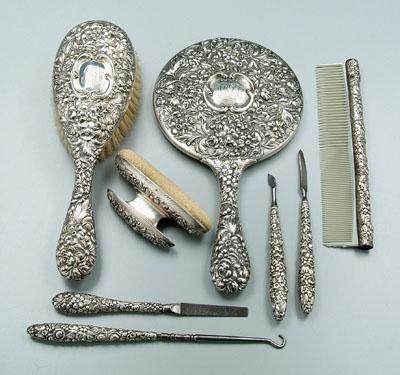 Appraisal: Sterling seven piece dresser set floral repousse decoration in hand