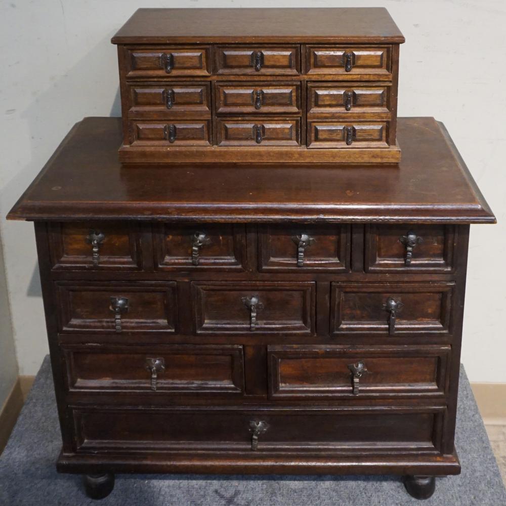 Appraisal: STAINED TEAK CHEST-OF-DRAWERS AND TABLE-TOP JEWELRY CHEST LARGER X X