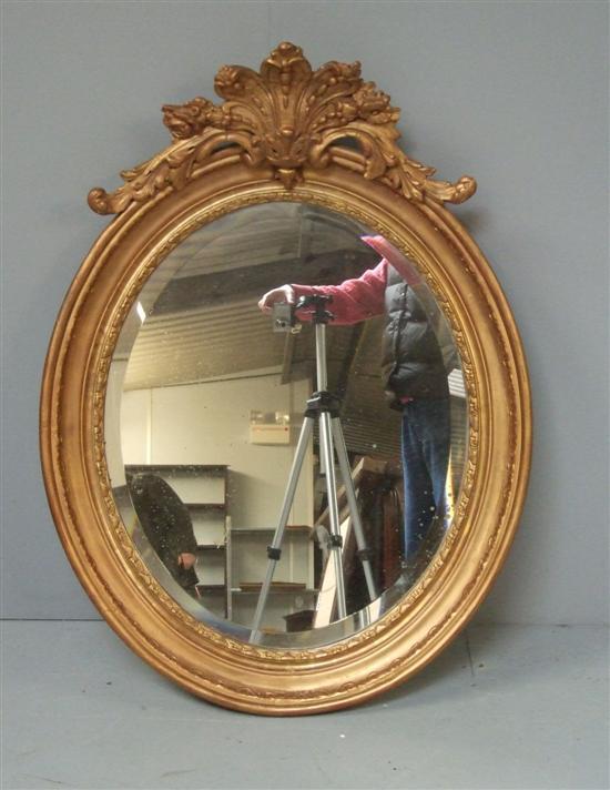 Appraisal: Oval gilt framed mirror th century with bevelled plate the