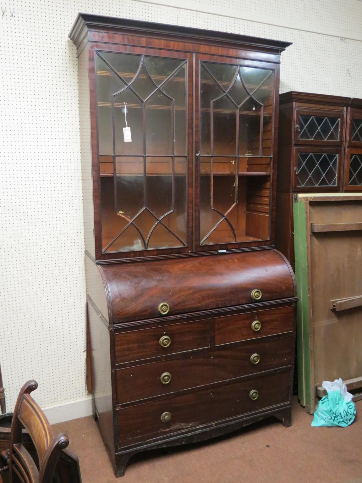 Appraisal: A George III mahogany cylinder bureau bookcase pair of astragal-glazed