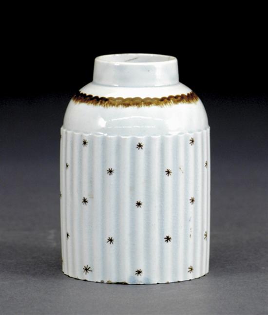 Appraisal: English earthenware tea caddy early th centuryreeded cylinder form painted