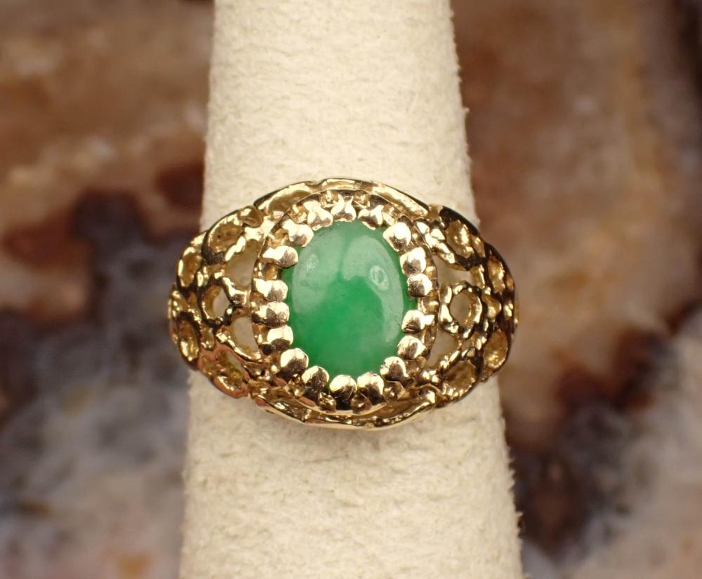 Appraisal: JADE AND FOURTEEN KARAT YELLOW GOLD RING The yellow gold