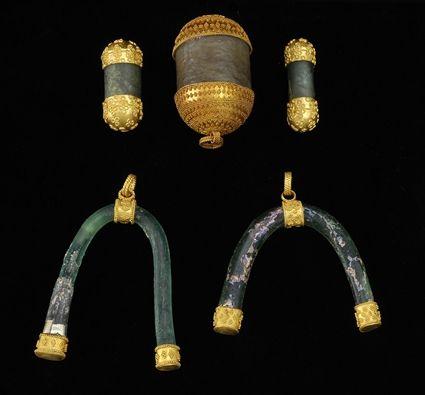 Appraisal: Two Glass and Gold Horseshoe-Form Pendants Two Barrel-Form Glass and