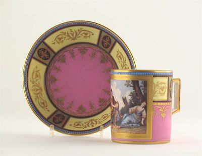 Appraisal: A Vienna-style coffee can and saucer painted with a man