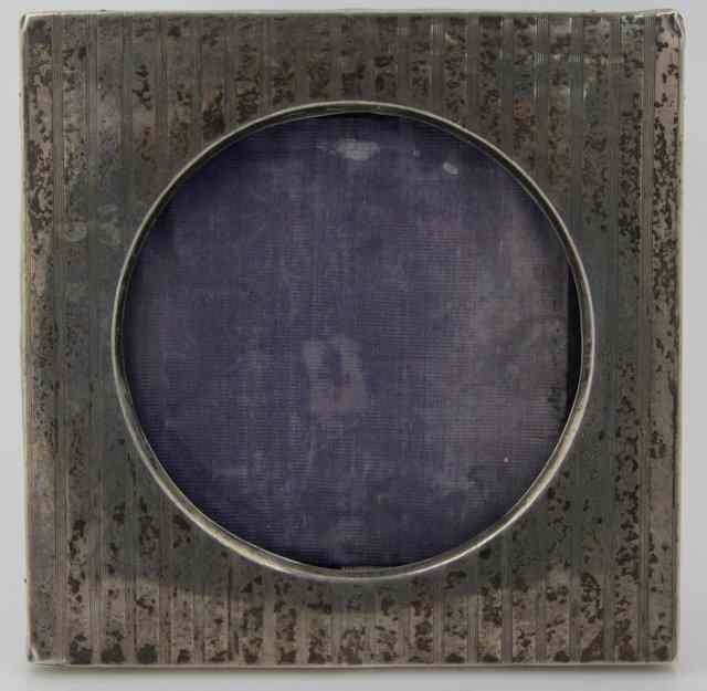 Appraisal: A silver photograph frame Birmingham with striped decoration and circular