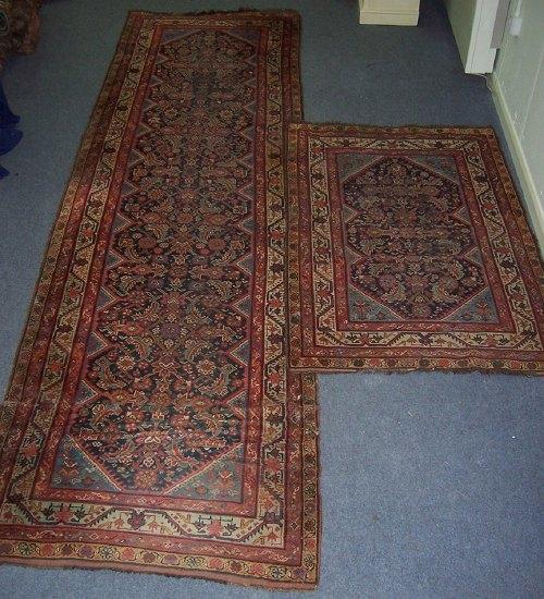 Appraisal: A Feraghan runner with central geometric blue ground field within