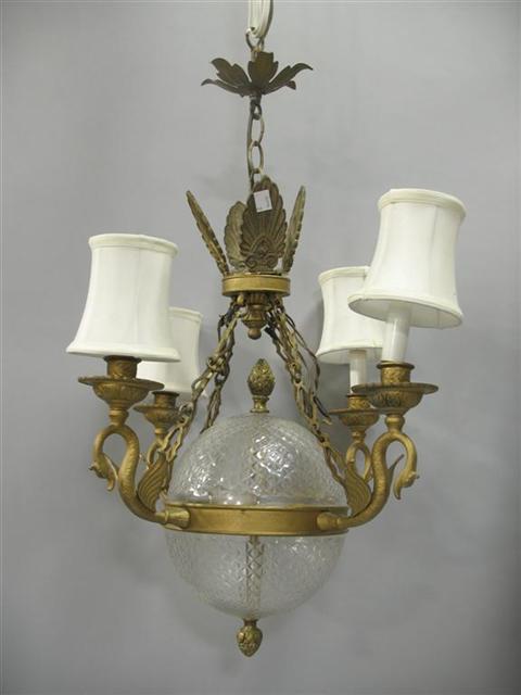 Appraisal: EMPIRE STYLE GLASS AND BRASS CHANDELIER The four lights on