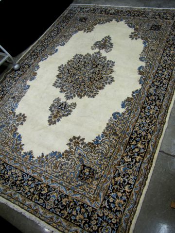 Appraisal: Oriental Rug Persian Kerman cream field with blue border and