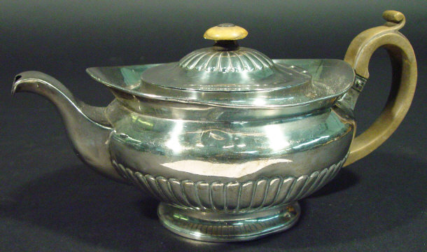 Appraisal: Georgian Irish silver teapot of demi-fluted form with horn handle