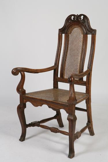 Appraisal: AN EARLY TH CENTURY CONTINENTAL ARMCHAIR the tall back with