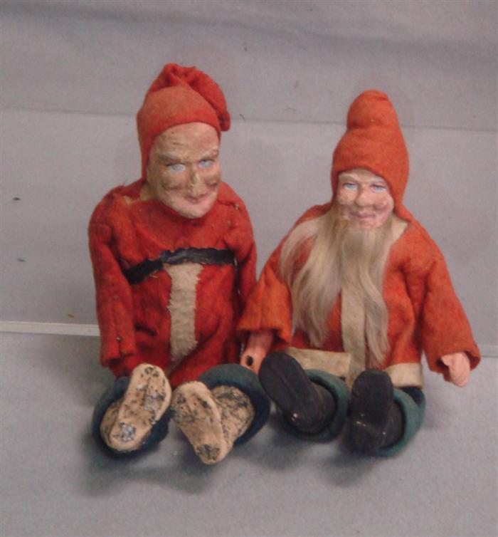 Appraisal: jointed seated belsnickle figurines red felt jackets and hats blue