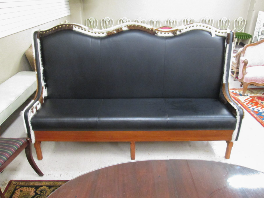 Appraisal: LARGE WINGBACK SETTEE custom made with cowhide and black faux